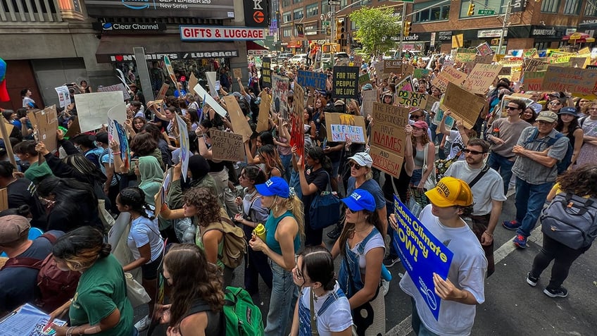 aoc joins thousands in new york climate change march with furious message for biden