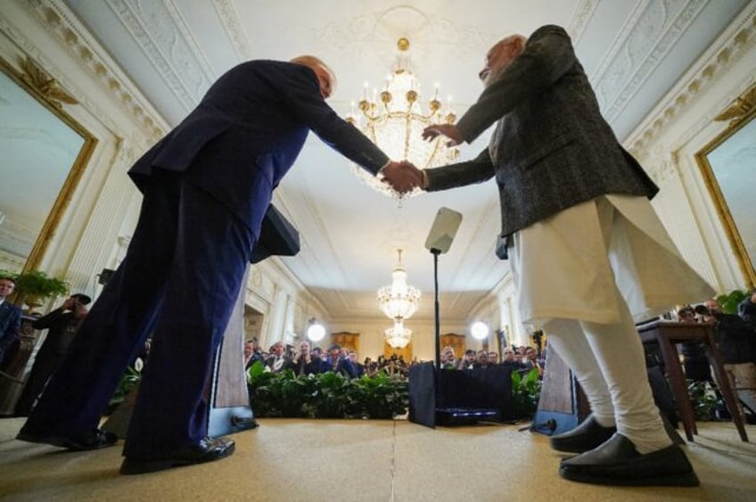 US President Donald Trump shakes hands with Indian Prime Minister Narendra Modi during a j