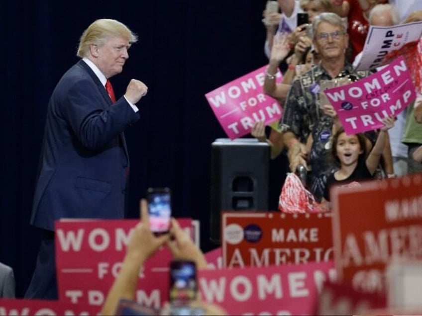 Republican presidential candidate Donald Trump takes the stage at a campaign rally Saturday, Oct. 29, 2016, in Phoenix. (AP Photo/John Locher)