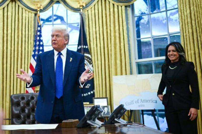 US President Donald Trump speaks after Tulsi Gabbard (R) was sworn in as director of natio