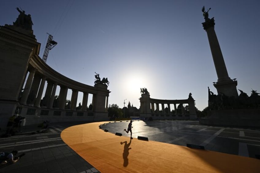 A runner competes in the men's marathon at the World Athletics Championships in Budapest, Hungary, Sunday, Aug. 27, 2023. (AP Photo/Denes Erdos)