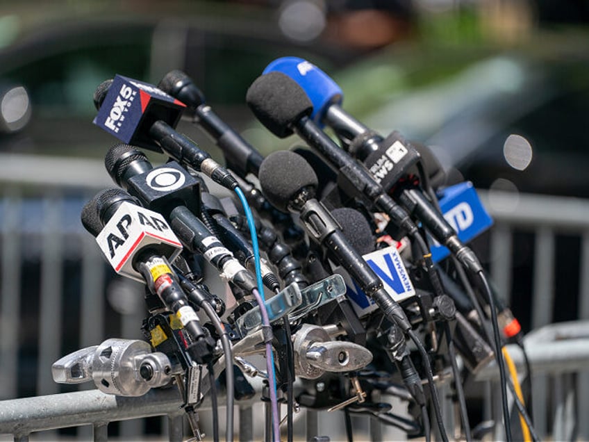 NEW YORK, NEW YORK - MAY 28: Microphones from various media outlets set up outside of Manh