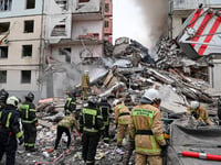 Apartment building partially collapses in a Russian border city after shelling. At least 13 killed