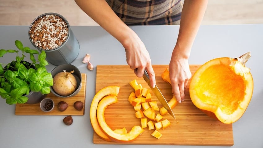 cutting pumpkin pieces