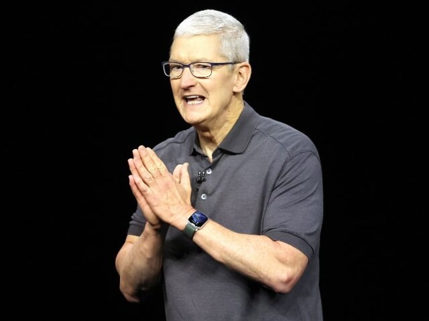 Apple boss Tim Cook with hands together