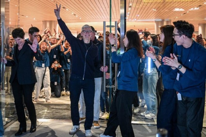 Apple CEO Tim Cook attended the opening of his company's newest store in Shanghai, amid gr