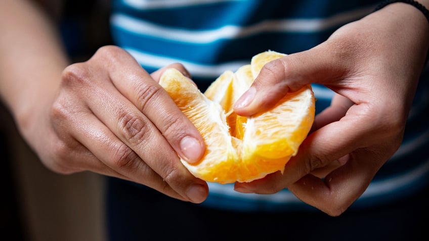 eating an orange slice