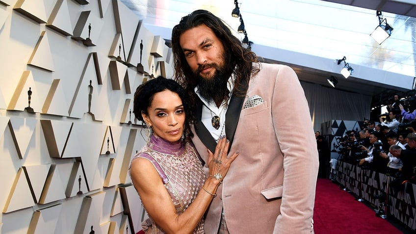 Jason Momoa embracing Lisa Bonet