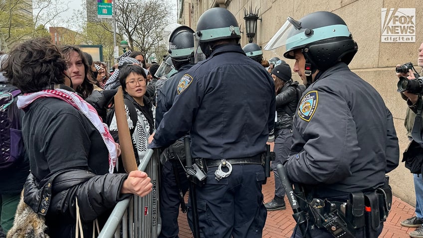 NYPD officers patrol as pro-Palestinian protestors demonstrate outside of Columbia University’s campus