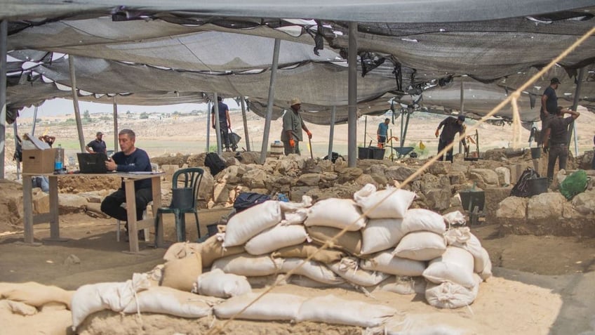 Archaeologists working at site