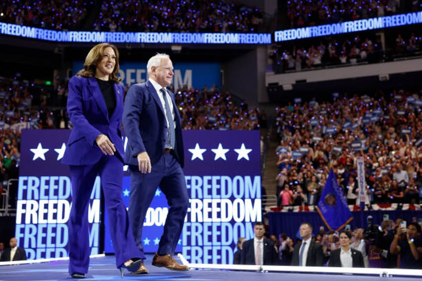 Democratic presidential candidate, U.S. Vice President Kamala Harris and democratic vice presidential candidate Minnesota Gov. Tim Walz walk onstage...