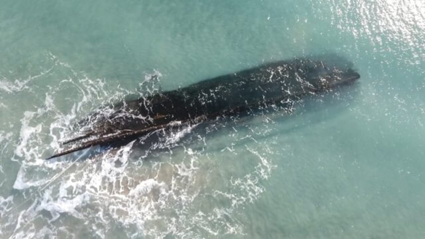 An aerial view of an old shipwreck on the shore of Cape Ray, Newfoundland and Labrador, Canada on January 30, 2024