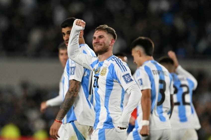 Argentina's midfielder Alexis Mac Allister celebrates scoring his team's opening goal in t