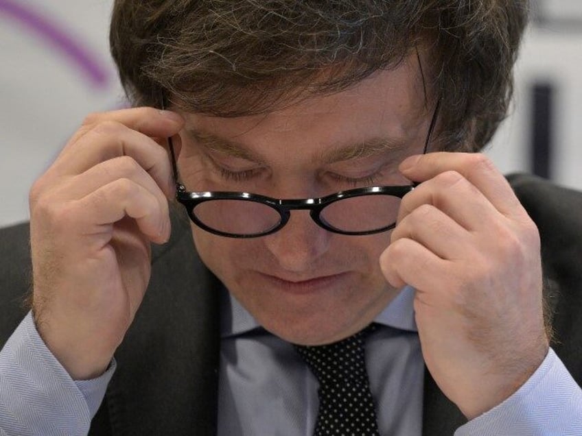 Lawmaker and presidential candidate for La Libertad Avanza party, Javier Milei, adjusts his glasses during a press conference in Buenos Aires on October 11, 2023, ahead of Argentina's presidential elections. The campaign for the 22 October elections in Argentina heated up on Wednesday with a clash of accusations between President …