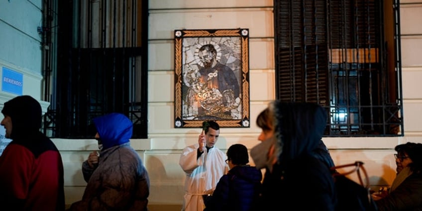 argentines ask patron saint of work for jobs as economy tanks elections loom