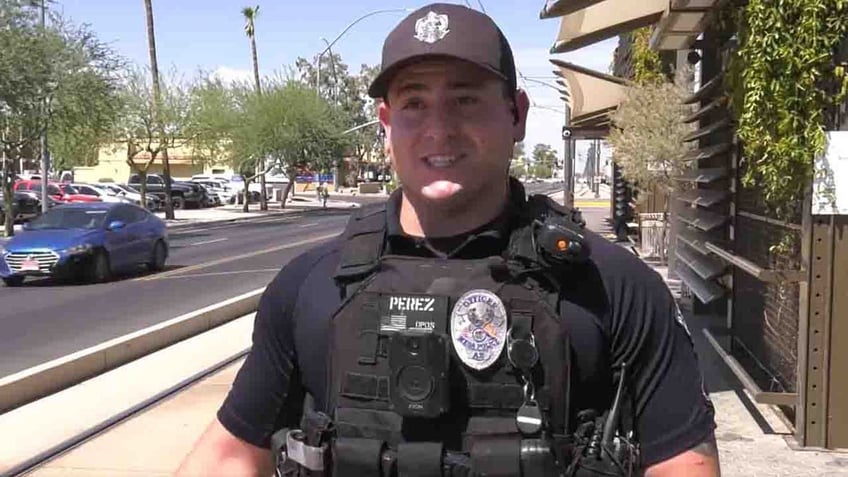 arizona cop retired paramedic save baby who stopped breathing bodycam video shows