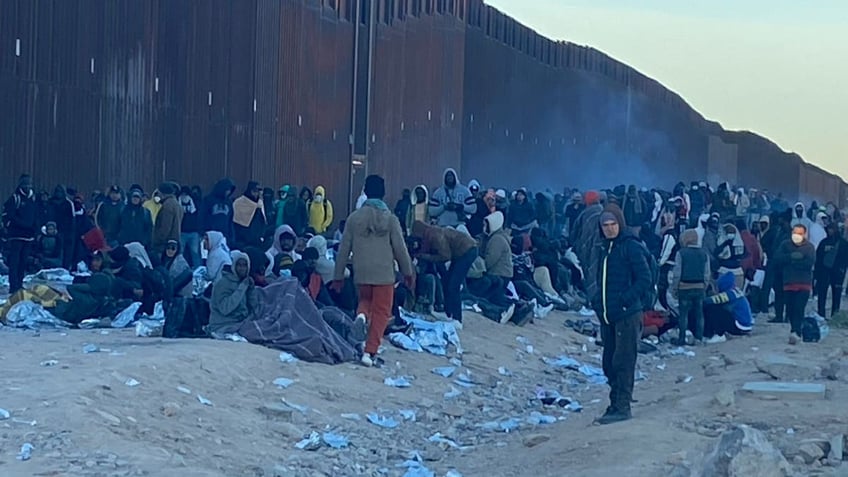 Migrants are seen camped out near Lukeville, Arizona.