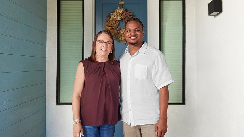 Wanda Dench and Jamal Hinton pose ahead of Thanksgiving