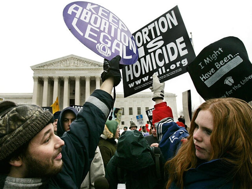 WASHINGTON - JANUARY 24: Pro-life activist Jessica Meunier (R) of Fitchburg, MA, and pro-a