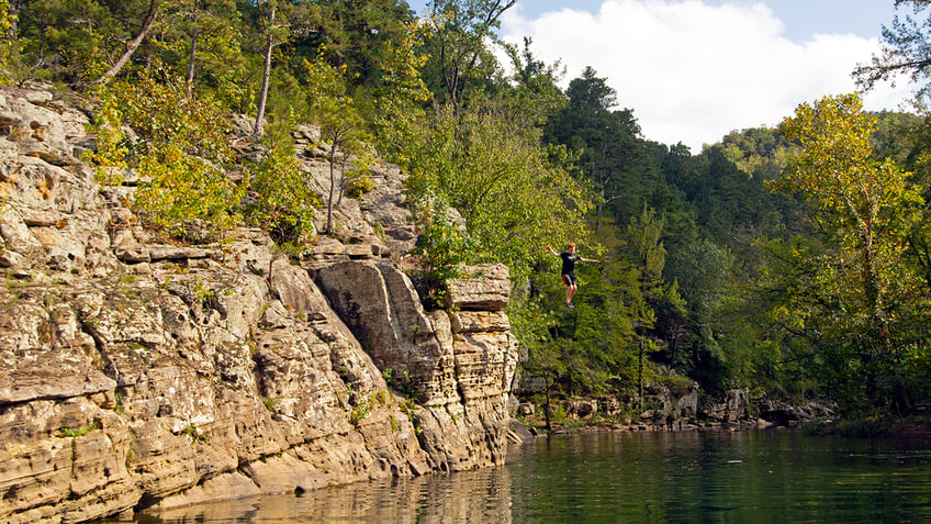Boy jumps into Arkansas river