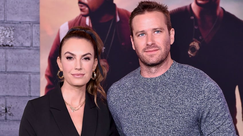 Elizabeth Chambers and Armie Hammer attend an event