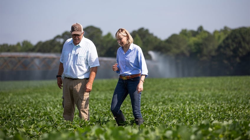 Laurie Buckout walking in a field.