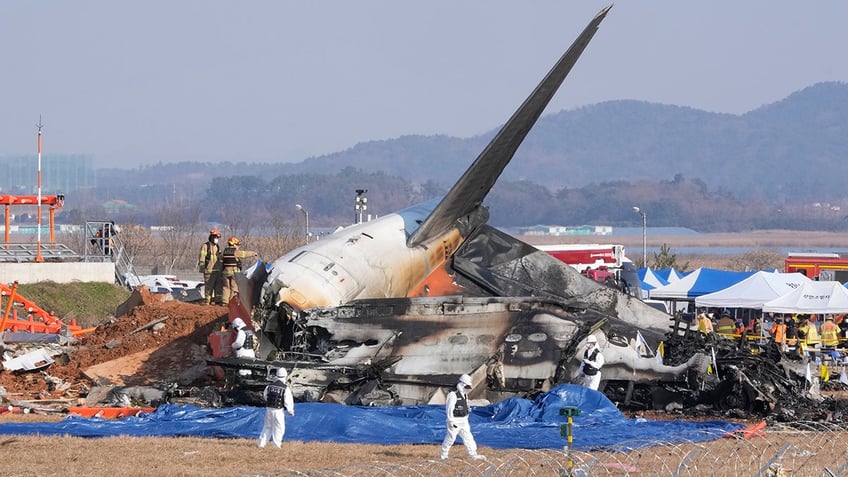 South Korea plane crash aftermath with rescue team