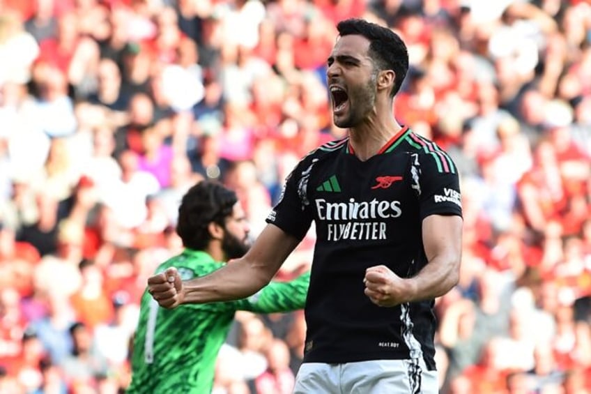 Arsenal midfielder Mikel Merino celebrates after scoring at Liverpool