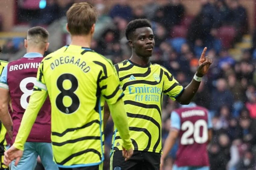 Arsenal's Bukayo Saka (C) celebrates after scoring against Burnley