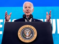 As Biden dodges press on Brazil trip, frustrated reporters resort to holding up signs with questions