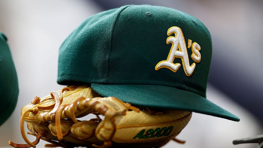 A's hat on glove