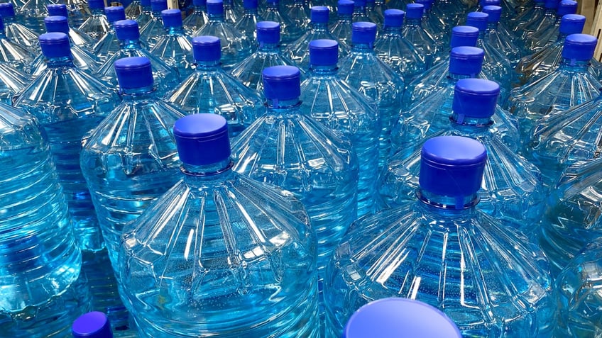 Gallons of bottled water are shown.