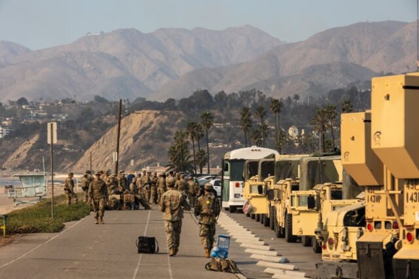 Members of the National Guard take a break along California's Pacific Coast Highway while