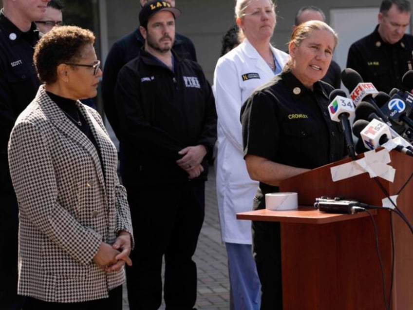 Los Angeles Mayor Karen Bass, left looks on as Los Angeles Fire Department Chief Kristin C