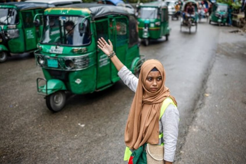 Student volunteers have brought a new enthusiasm to the vocation as they wave through cars