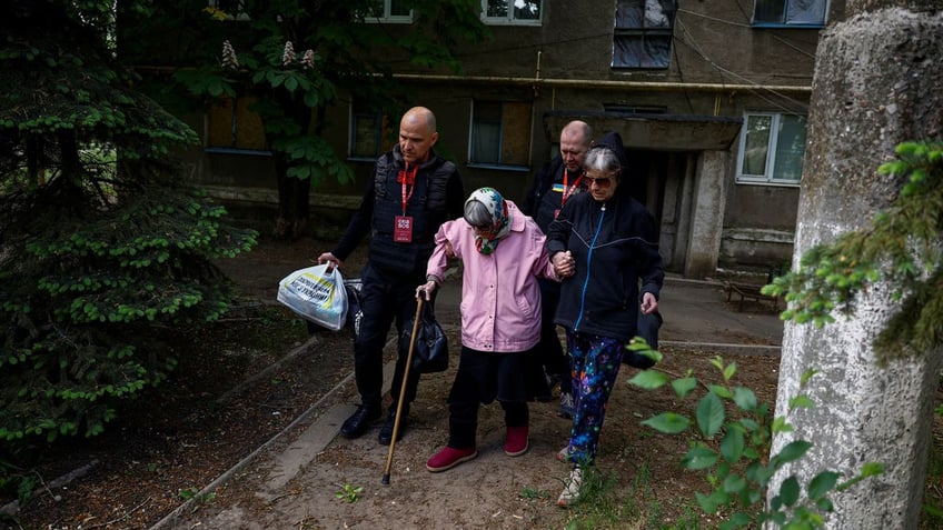 Volunteers with the EastSOS non-government organization help evacuate Ukrainians who live near the front lines.