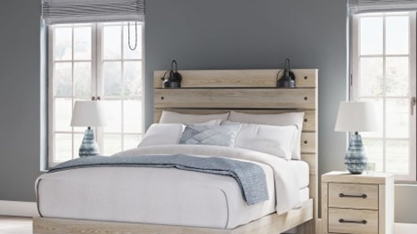 A rustic bed frame with built-in lamps is the ideal addition to any bedroom.