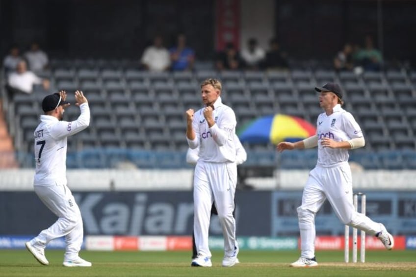 England's Joe Root celebrates taking the wicket of India's Ravindra Jadeja on the third day of the first cricket Test in Hyderabad