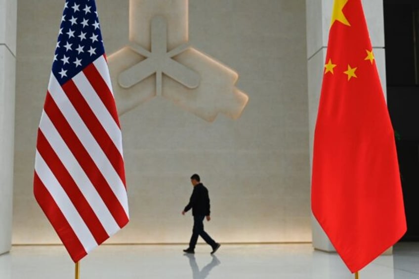 The US and China flags at the People's Bank of China prior to the arrival of US Treasury S