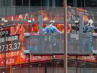 Asian stocks rise and oil prices slip after Treasury yields ease