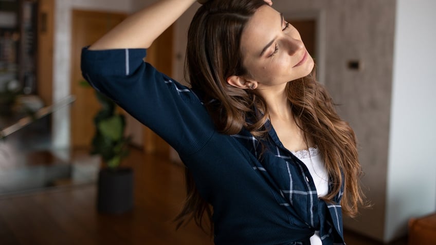 Woman cracking neck