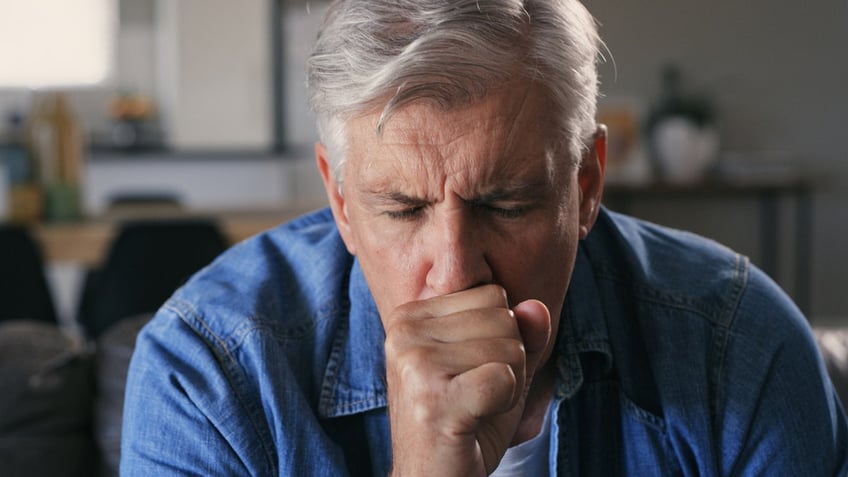 Man coughing