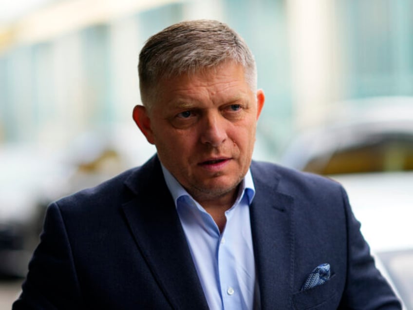 FILE - Chairman of SMER-Social Democracy party Robert Fico arrives at his party's hea