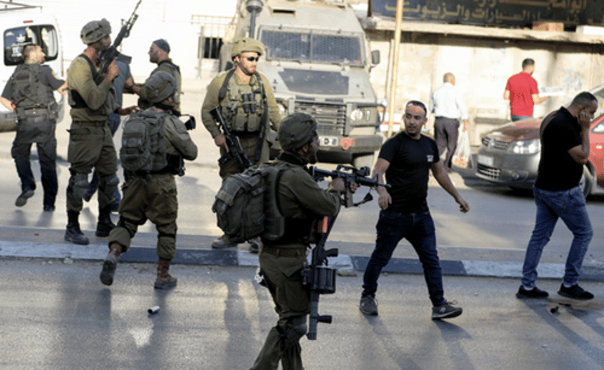 assault on 10 cities israel mounts largest raid on west bank since wars start