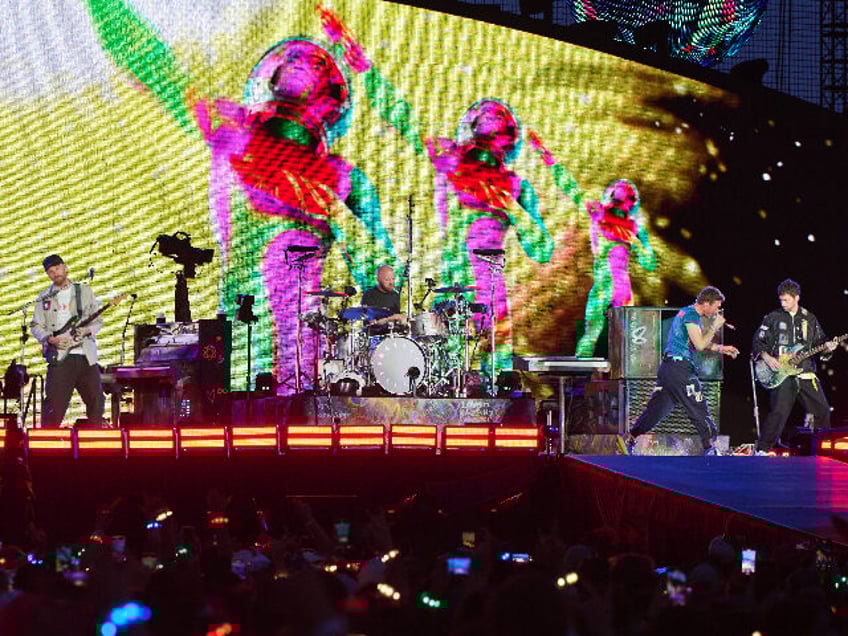 TORONTO, ONTARIO - JULY 07: (L-R) Jonny Buckland, Will Champion, Chris Martin and Guy Berr