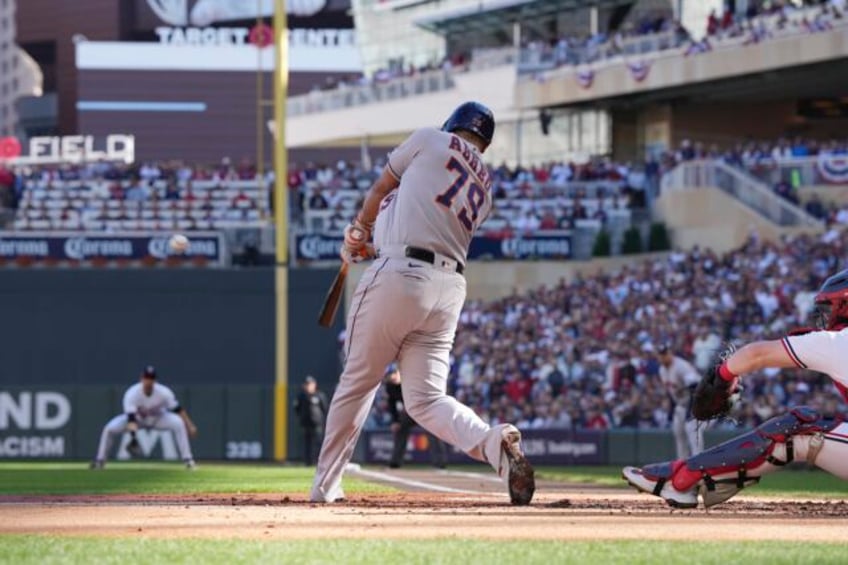 astros pound 4 homers with a pair by abreu to rout twins 9 1 and take 2 1 alds lead