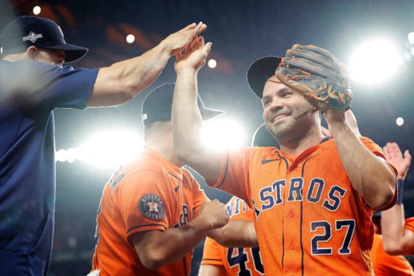 astros rally past rangers for dramatic mlb playoff win