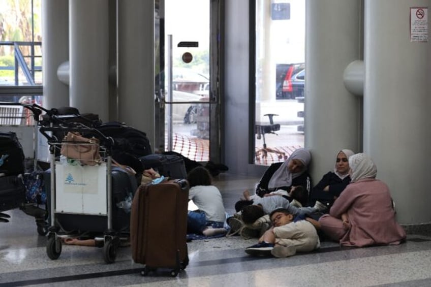 Passengers wait for their flights at Beirut International Airport, where several major air