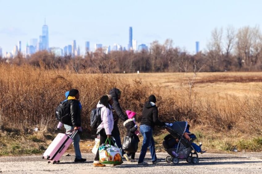 Seen from the runways of Floyd Bennett Field, the skyline of Manhattan is visible in the d