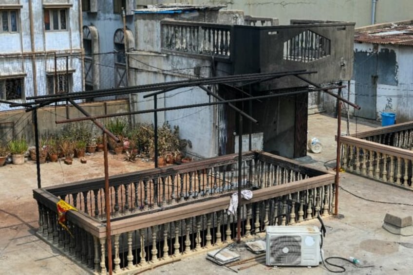 Scenes of damage from a fire at the Krishna Pearls building in Hyderabad, which killed at